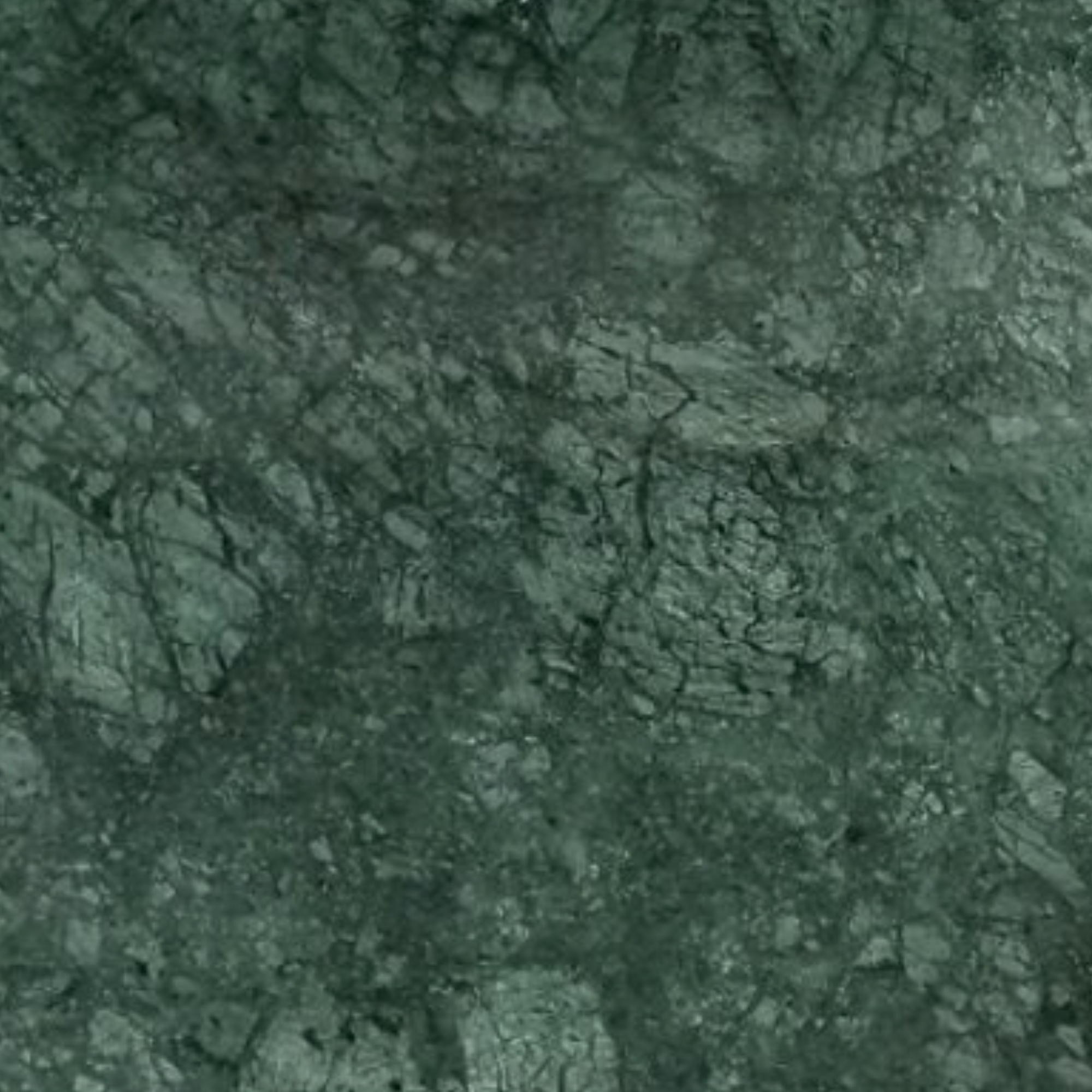 Verde Patricia — deep green marble with white crystalline veining